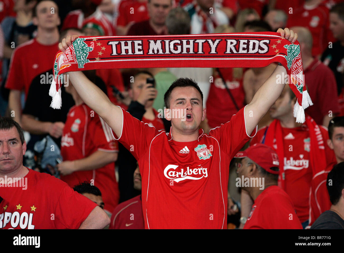 Name:  a-liverpool-football-fan-holds-up-a-scarf-in-the-stands-during-a-match-BR771G-1844285587.jpg
Views: 613
Size:  181.2 KB